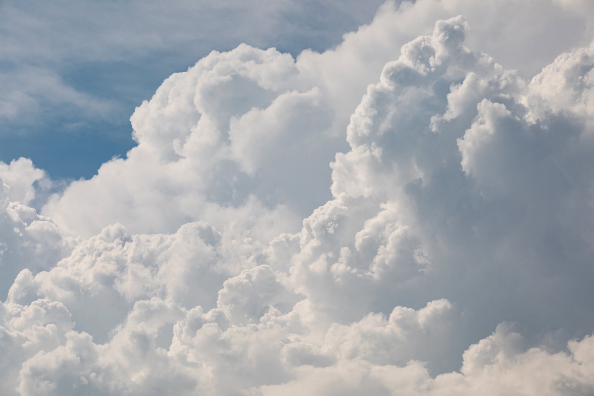 White, fluffy clouds against a blue sky.