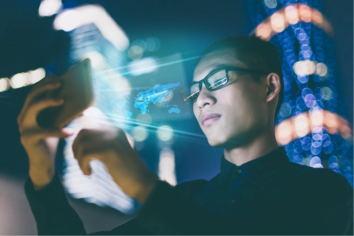 A photo illustration showing a person using a high-tech mobile device.