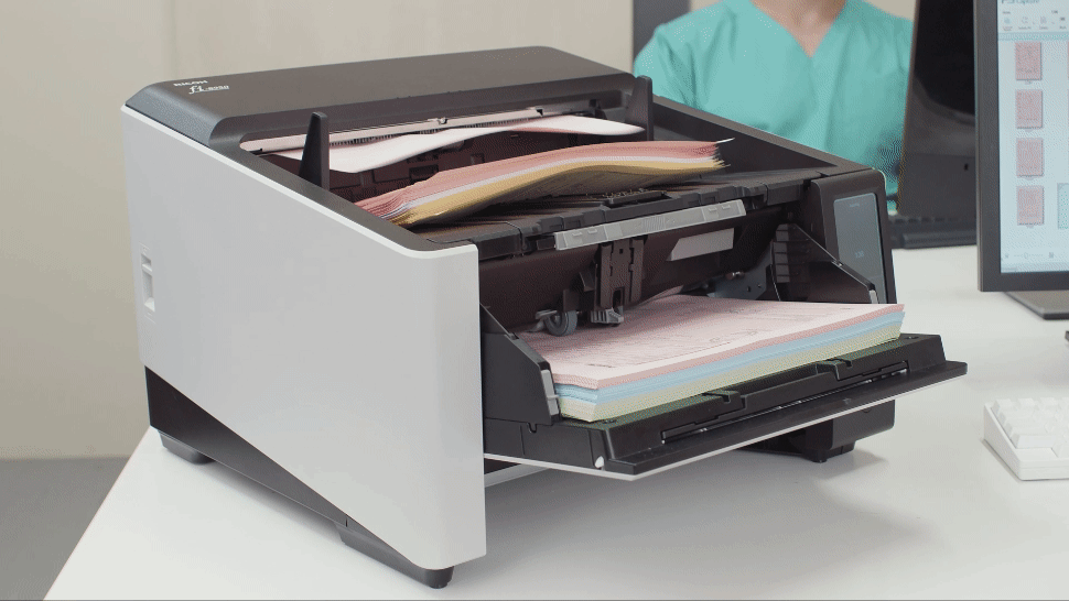 The Ricoh fi-8950 production scanner scanning volumes of documents.
