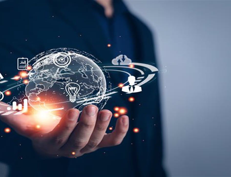 Image of a person holding a digital globe with digital concepts floating around. 