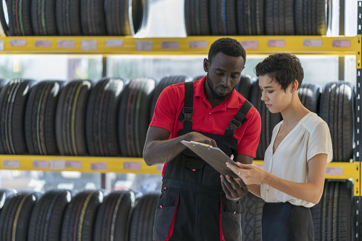 Tire retail manager explains invoice to customer