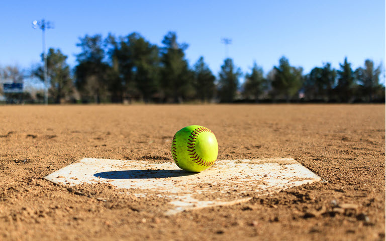 Green softball on mound. 