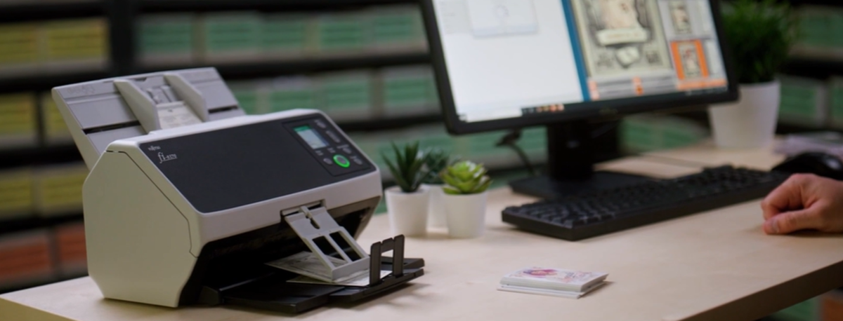 RICOH fi-8170 Document Scanner scanning trading cards.