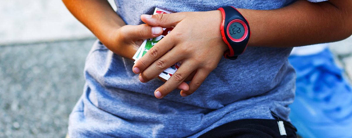 Boy holding a stack of trading cards