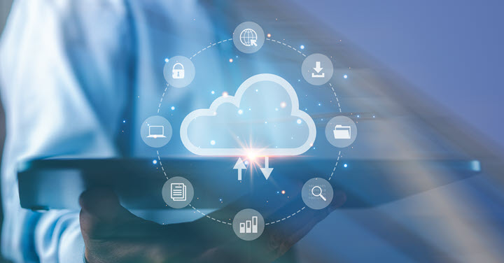 Image of cloud-based solution atop of a tablet held by a person. 