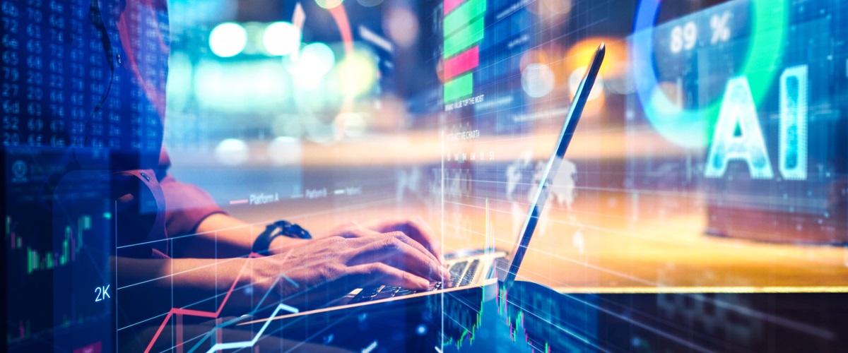 A business person types on a laptop. Charts, graphs, and the word AI are layered on top.