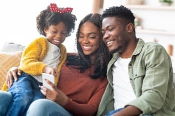 Family looking at phone
