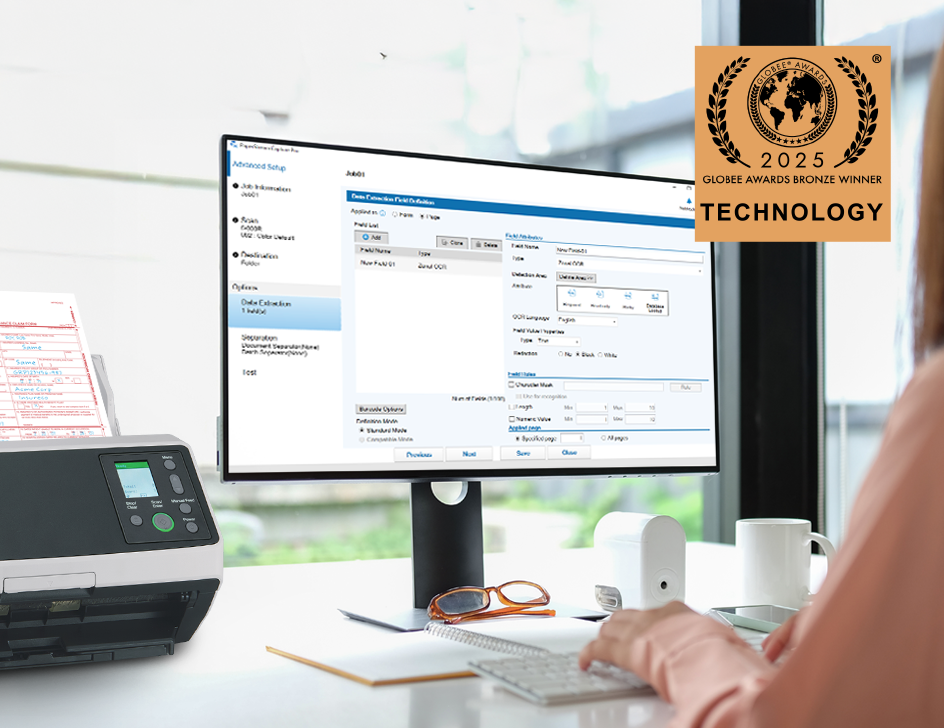 Person sitting in front of a monitor with PaperStream Capture Pro on the screen with Globee Bronze Technology Award logo